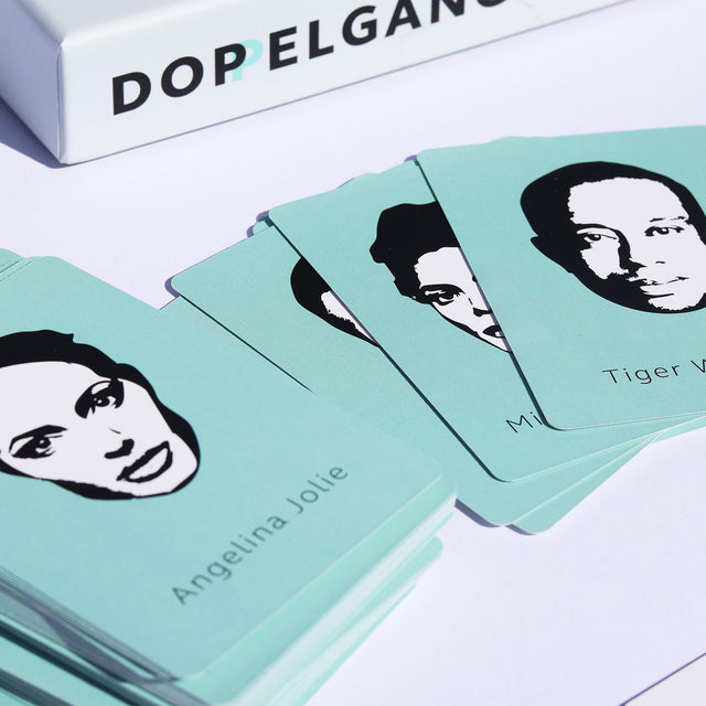 Doppelganger party game celebrity face cards close up 