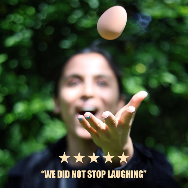 The Egg Game by Pikkii 5 star review with lifestyle image of player throwing egg in the air