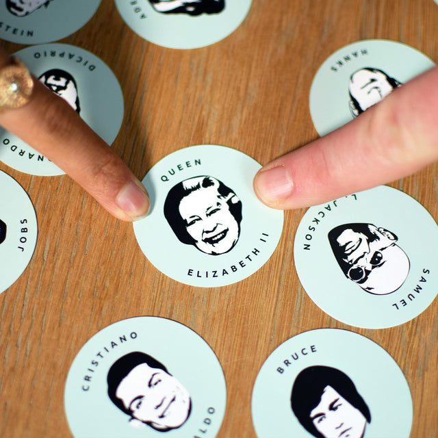 Find the face gameplay with 2 players landing on Queen Elizabeth the 2nd