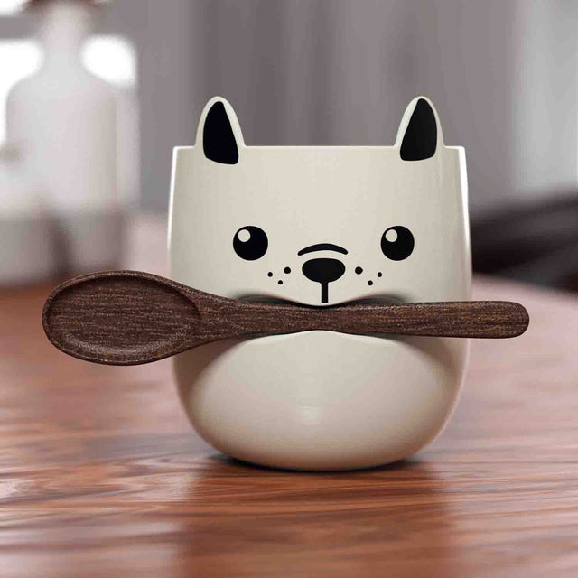 Pikkii - Dog Mug + Stick Spoon - Front View with Spoon In Mouth On Table