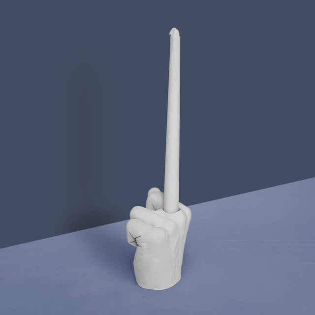 Pikkii Middle Finger Candle Holder on Blue background 