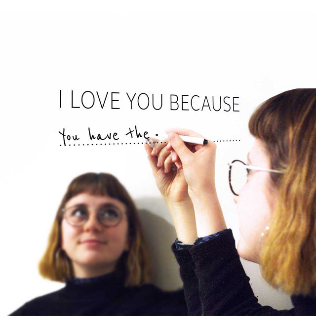 Woman filling in I Love You Because perosnalised decal