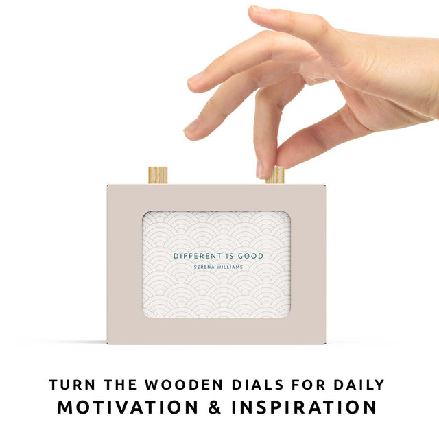 Pikkii 101 quotes by inspiring woman scroll box hand twitsting dial of scroll box over white background turn dials for daily motivation and inspiration
