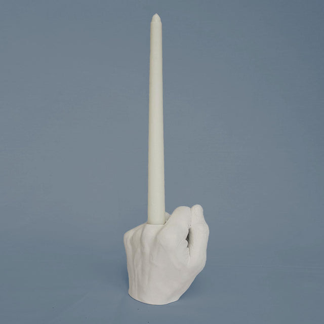 Pikkii Middle Finger Candle Holder on light blue background