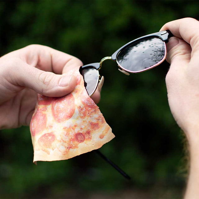Man using Pizza Microfiber cloth to clean glasses lenses