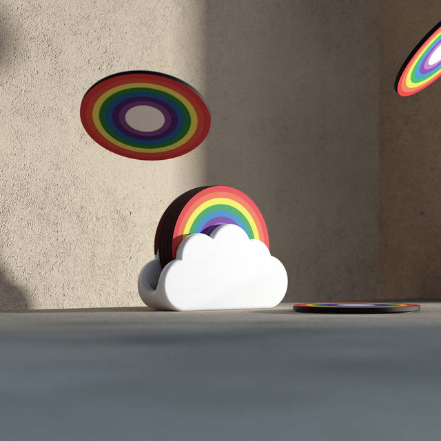 Pikkii Nesting wooden rainbow coasters in a white ceramic cloud holder