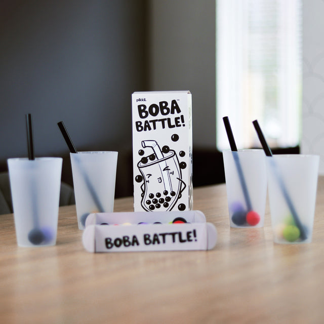 Boba Battle by Pikkii game set up including arena filled with cotton paper boba balls, cups and straws.