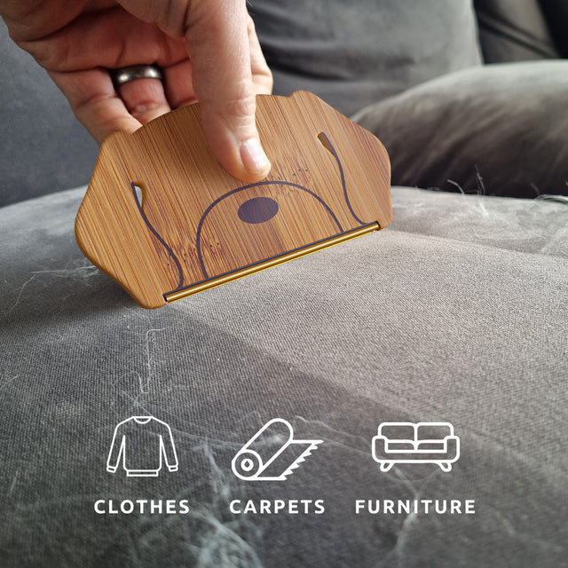 Sustainable Bamboo Dog Hair Remover by Pikkii cleaning sofa with icons overlay - suitable for use on clothes, carpets and furniture