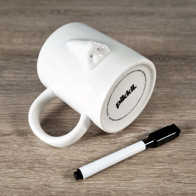 Coffee mug with nose and a dry wipe pen