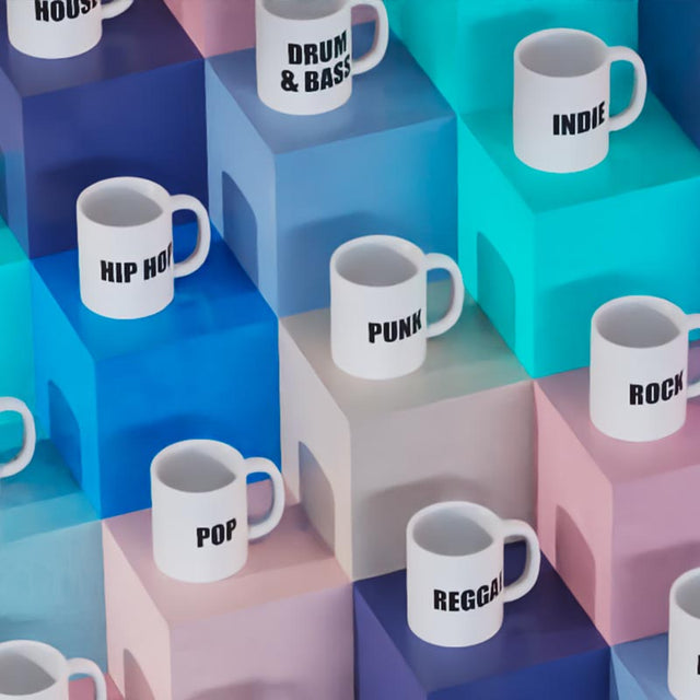 Birds eye view of Limited Edition Music Mugs arranged on colourful boxes