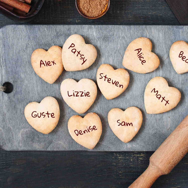 Personalised Heart Shape Cookies on bread board in kitchen