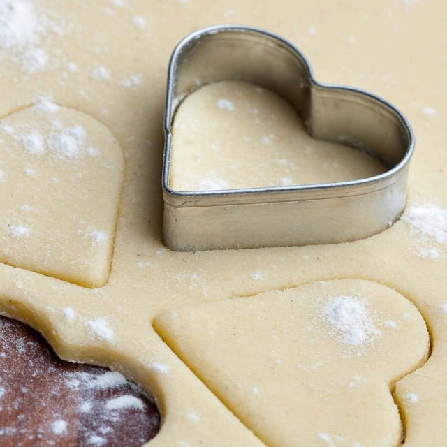 Heart Shaped Cookie Cutter pressed on cookie dough