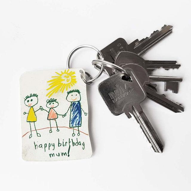Piikkii Kids Drawing Shrink keyring Kit Child's drawing with personalised happy birthday message keyring on keys over white background