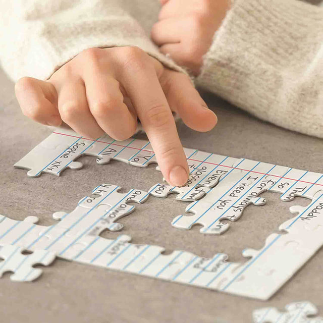 Womans Hands assembling Pikkii's Personalised Letter Jigsaw Puzzles
