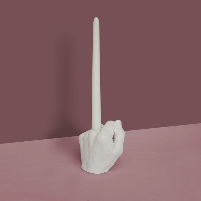 Pikkii Middle Finger Candle Holder on Purple background 