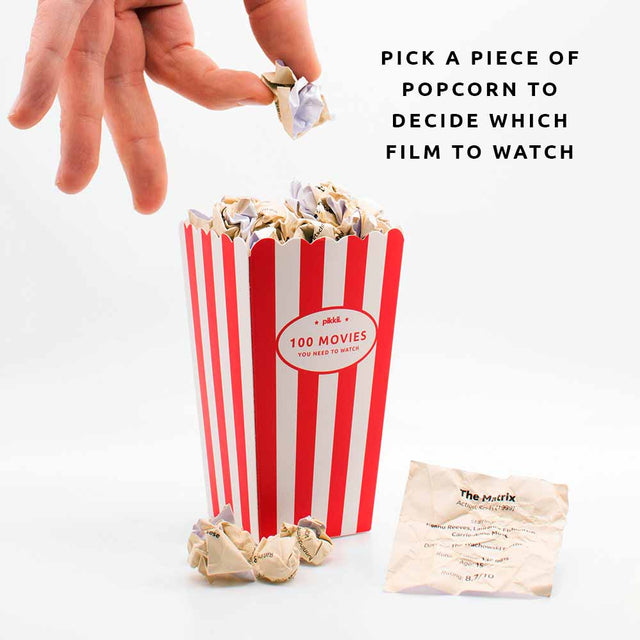 Movie Popcorn Bucket List with hand picking a scrunched paper popcorn piece