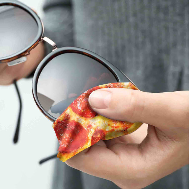 close up of a Man Cleaning sunglasses with Pikkii Pizza Fun Microfiber Cloth