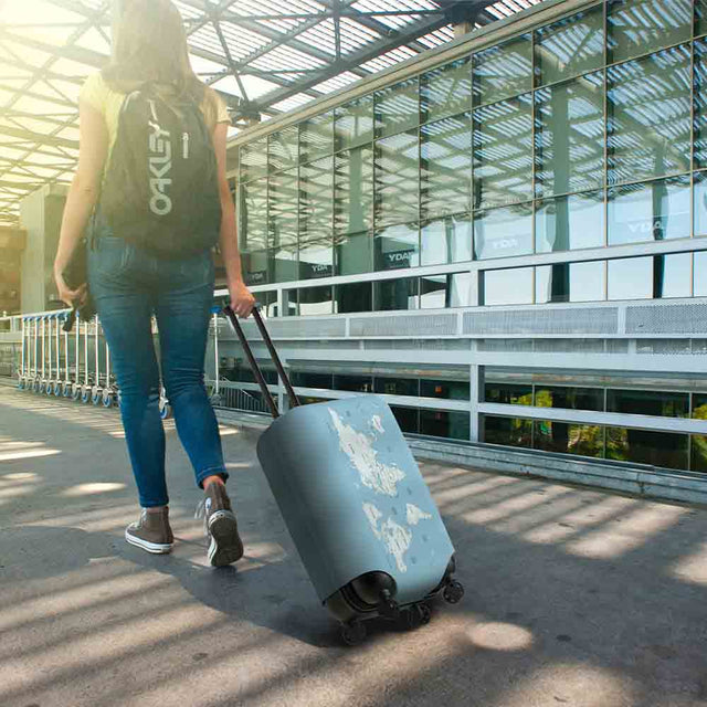 Woman pulling Travel Log Suitcase Cover in airport