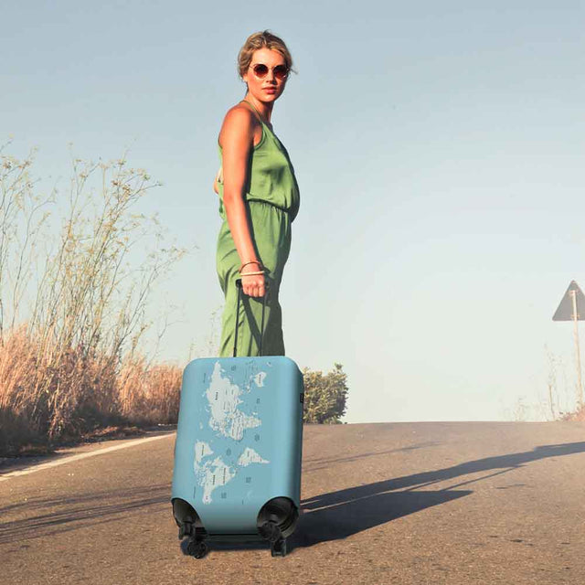 Woman pulling Travel Log Suitcase Cover on holiday
