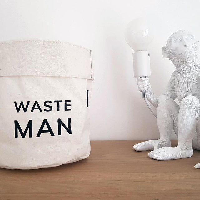 Pikkii Waste Man Bin next to a Saletti Monkey Lamp