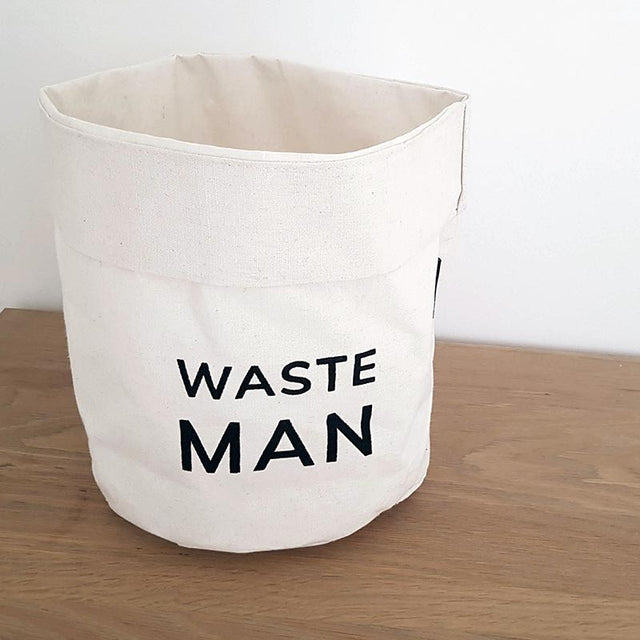 White bin with black Waste Man on Desk